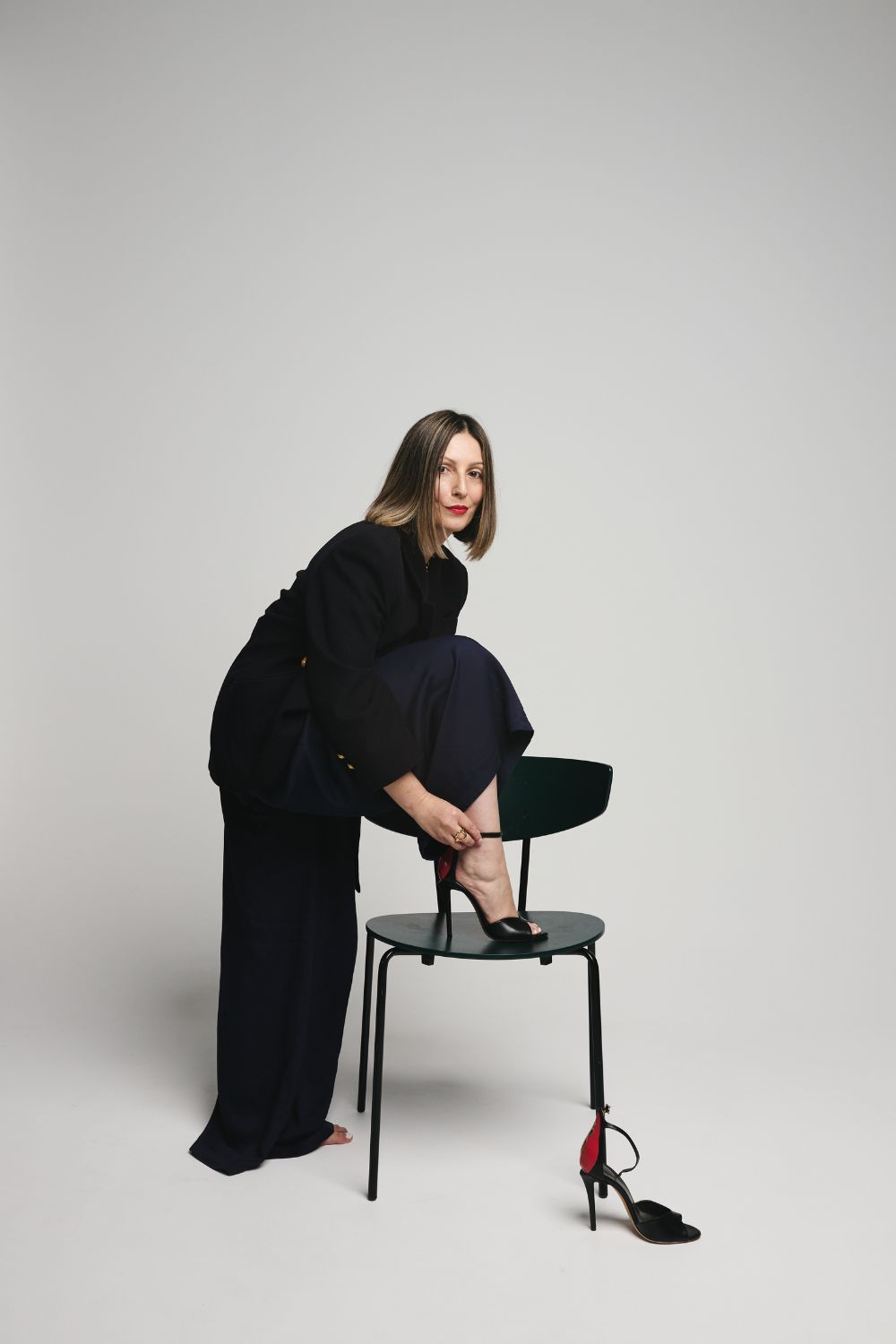 Roberta Lee - The Sustainable Stylist _ Style & Identity Expert London _ Sustainable Luxury Brands - Styling | Values-Based Styling, Stylist putting on a shoe Branding Shoot