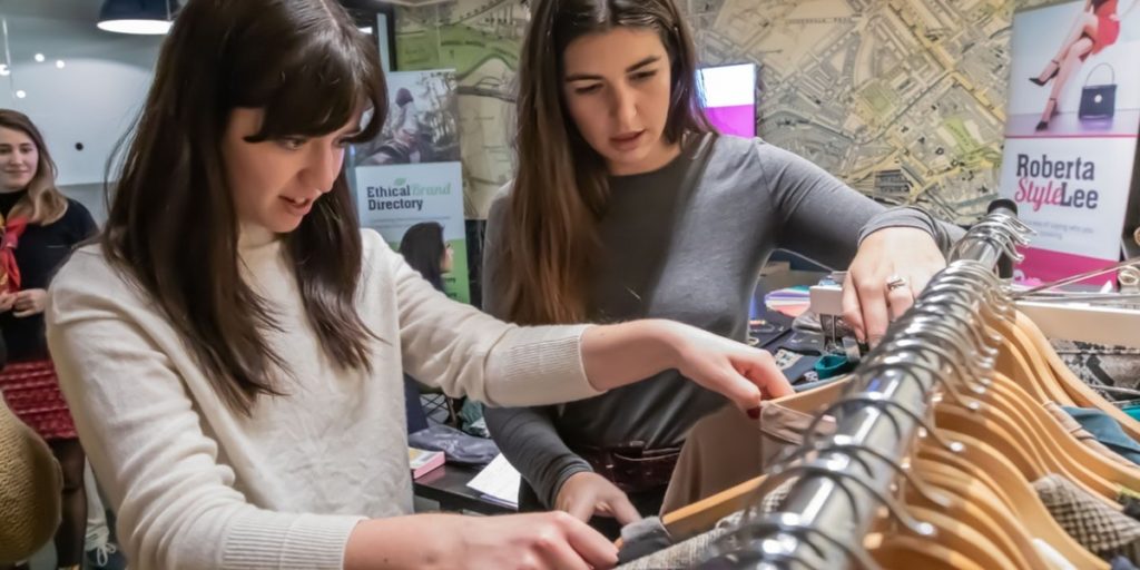 Sustainable Styling Workshop with personal stylist and sustainable style expert, Roberta Lee. Clients Personal Shopping and exploring pre-loved clothes on a rail in London. 