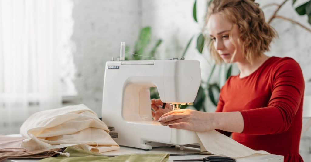 Roberta Style Lee BLOG What's the difference between a tailor, a dressmaker, seamstress or alterations specialist? | Woman at machine sewing