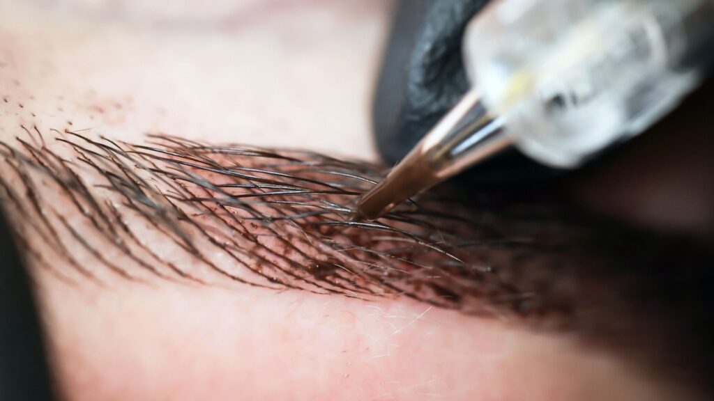 Microblading semi-permanent eyebrow tattooing - STOCK IMAGE