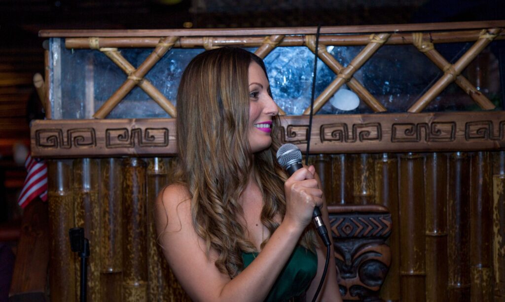 Roberta Lee - Sustainable Fashion Speaker at evening event in green dress